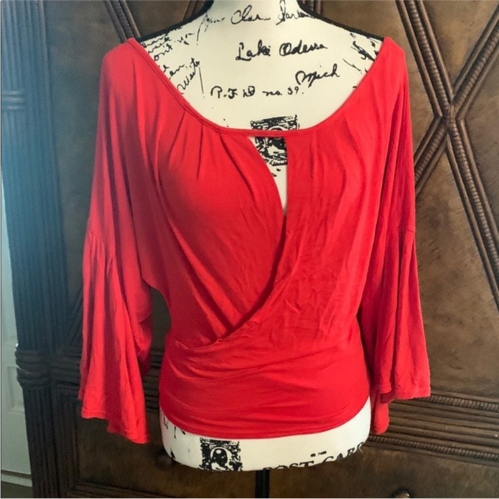 2 Free People tops Red and Black Tops both in good condition very nice